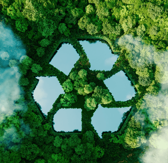 Aerial view of a forest with a recycling symbol formed by ponds