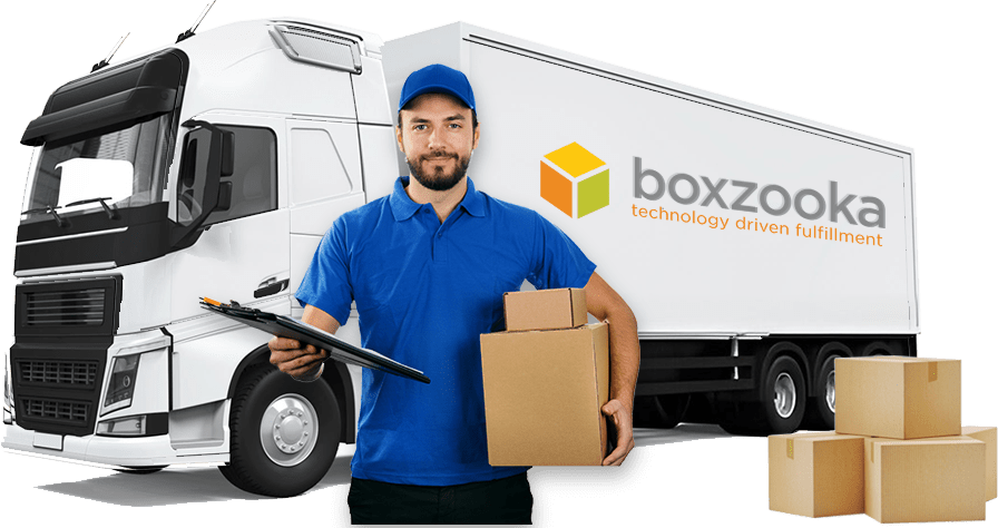 Boxzooka delivery driver in front of a branded delivery truck holding packages