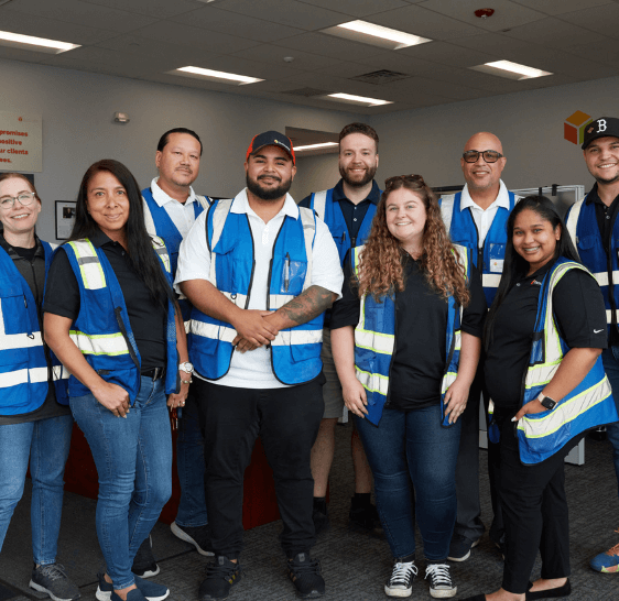 Boxzooka team posing together in branded vests