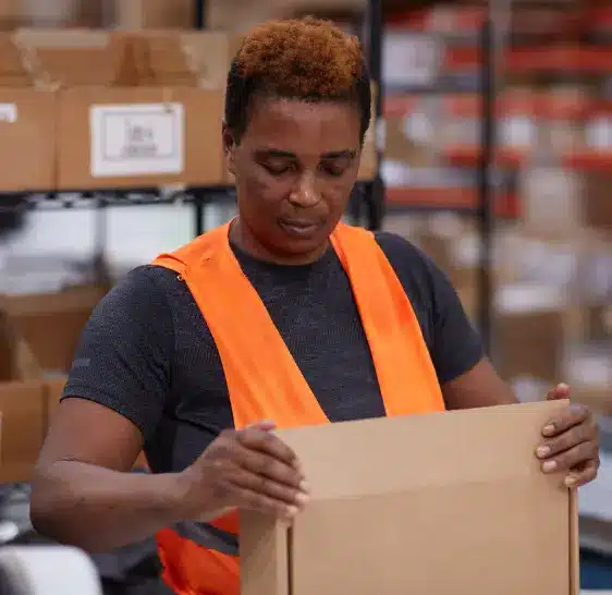 Warehouse associate packing a box