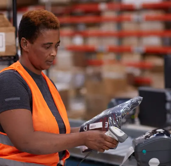 Warehouse associate scanning a package label