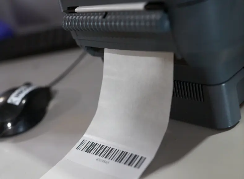 Close up of a shipping label printing a barcode