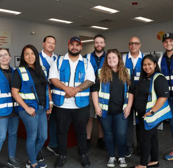 Boxzooka team posing together in branded vests