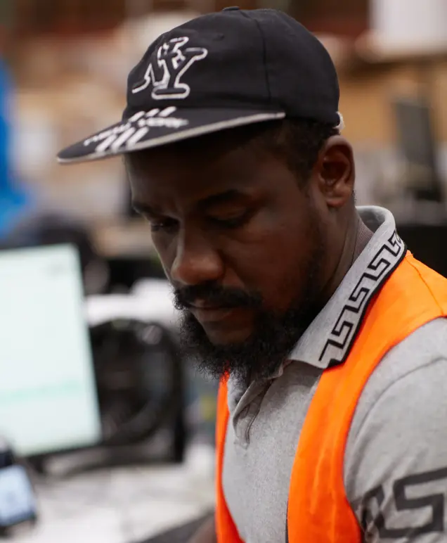 Boxzooka warehouse associate reviewing an order at a computer workstation