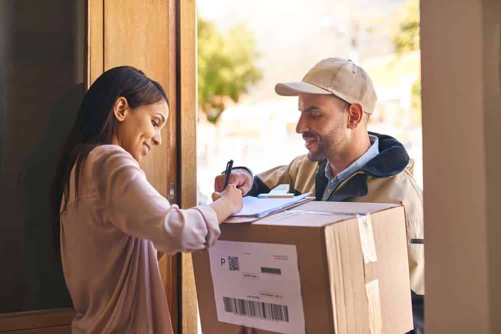 Delivery, box and package for signature and paperwork, distribution and parcel for logistics. Post officer, smile or shipping from male person