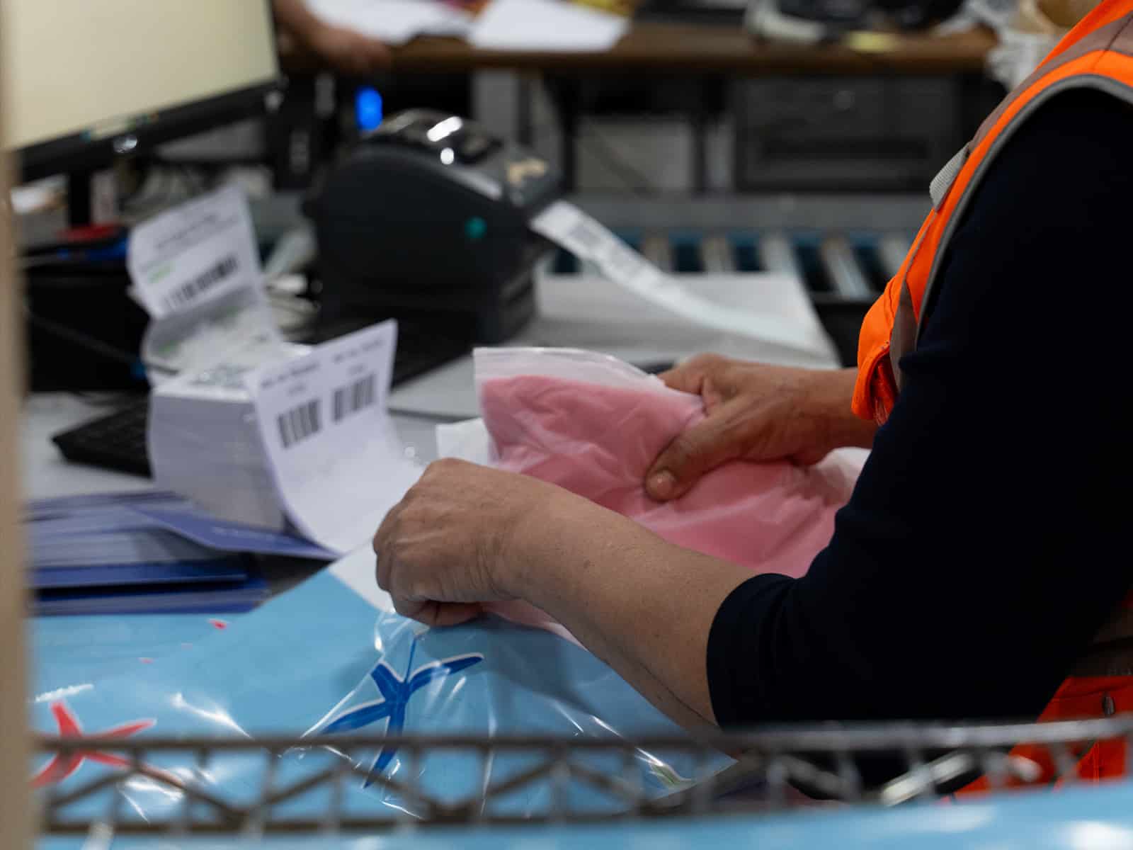 a worker assembles an order at a ship station