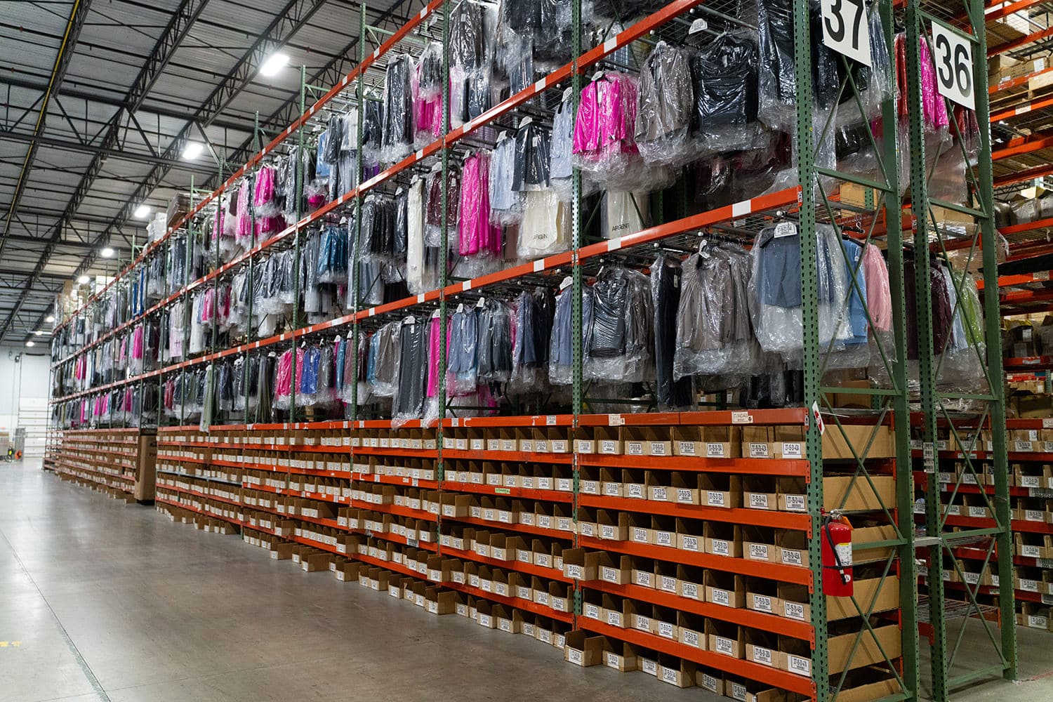 warehouse photo of GOH on racks and bins for apparel